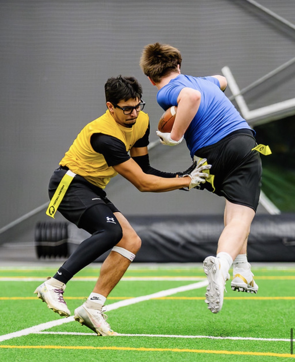 Eagles defender pulling the flag of a leaping ball carrier
