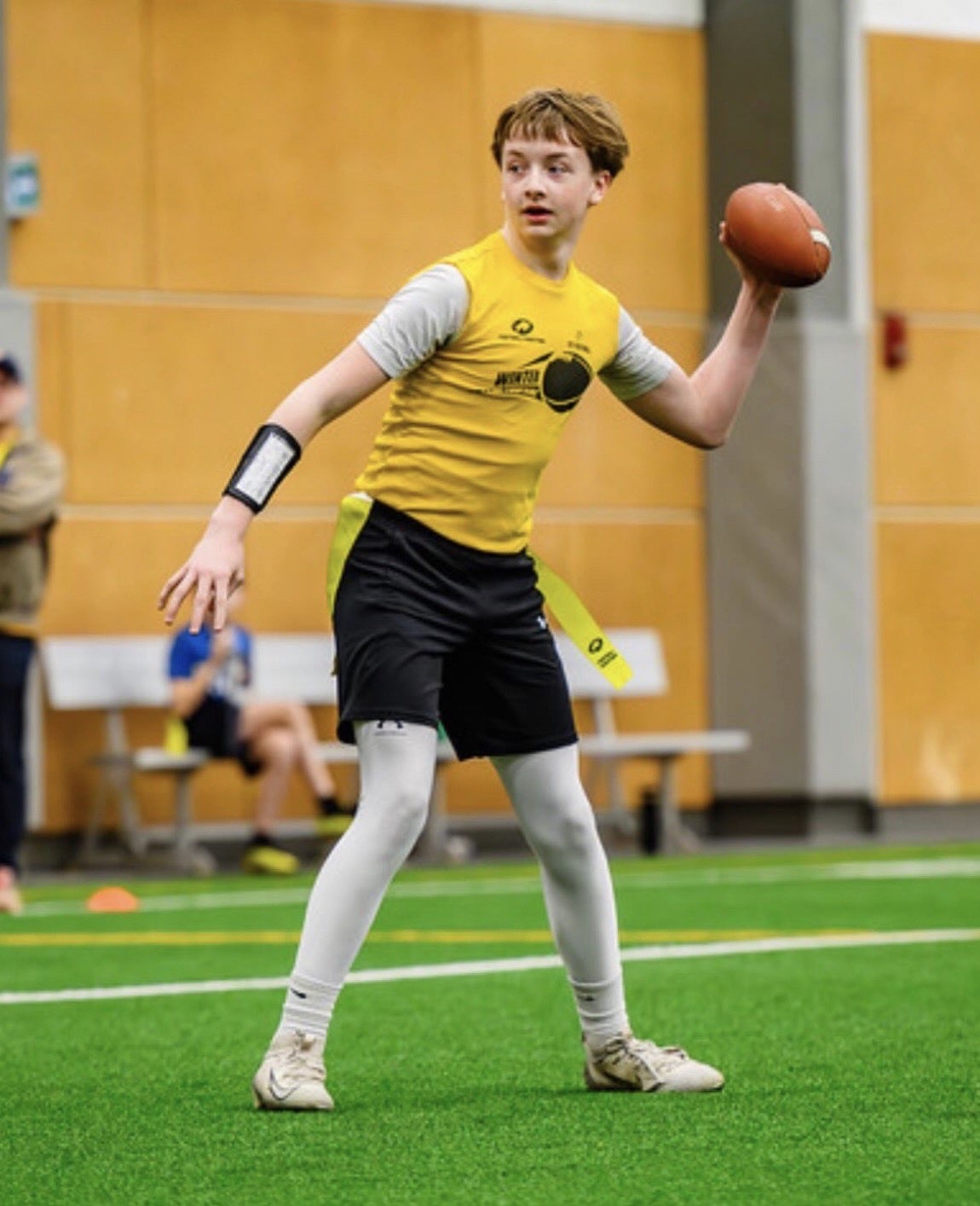 Eagles quarterback throwing a pass on indoor turf